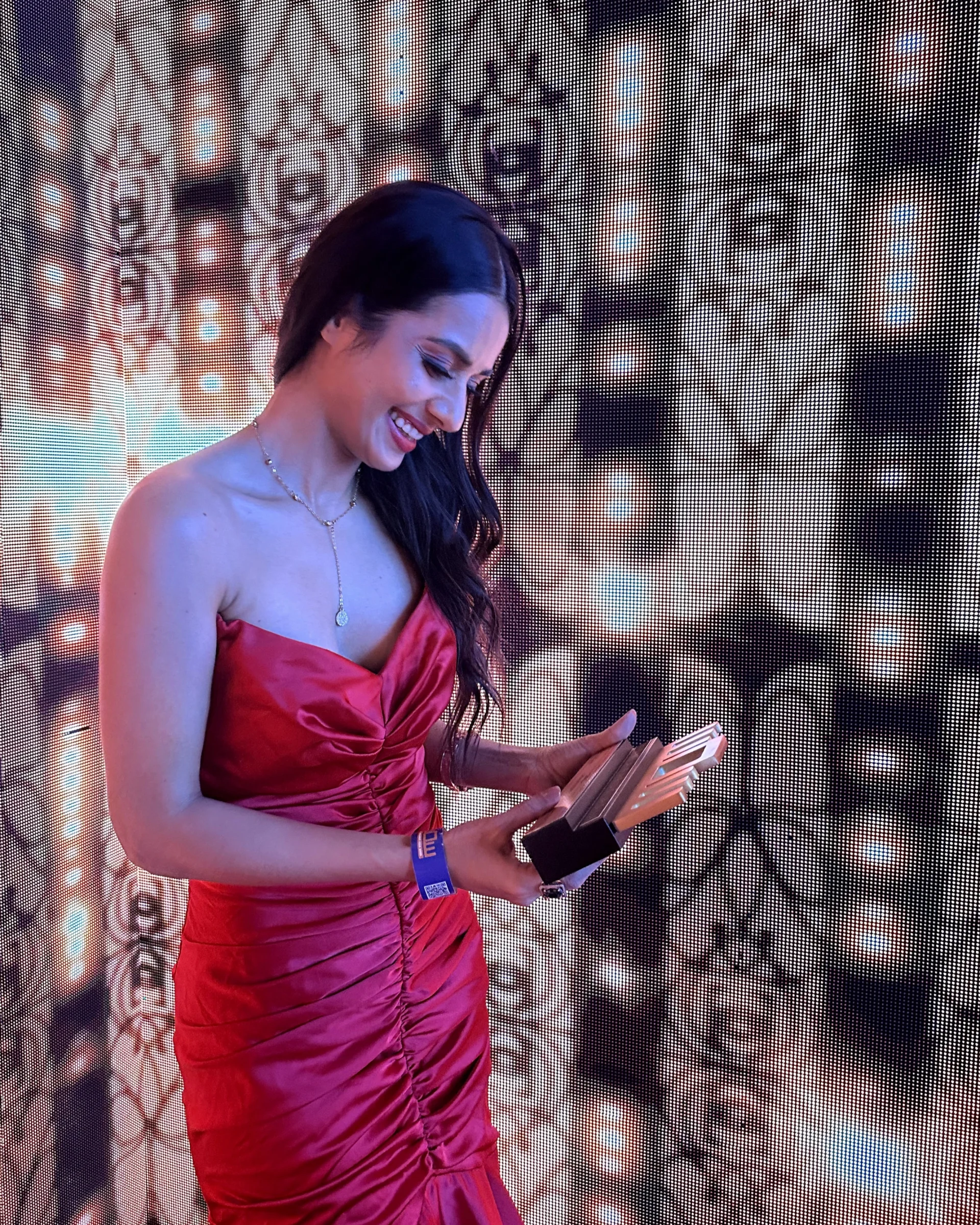 Lincia Rosario receiving Best Female Emcee — Weddings award